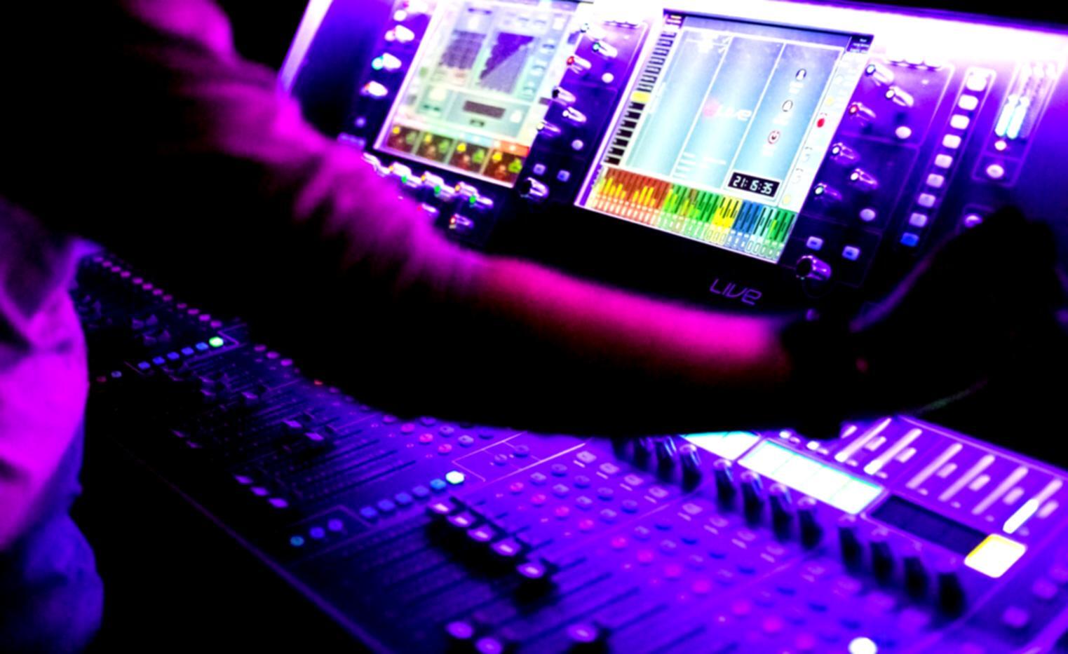 Digital audio workstation interface showing waveforms and mixing console